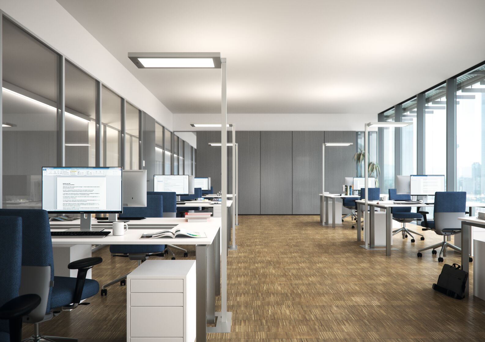 Ein modernes Büro mit 6 Arbeitsplätzen und Stehleuchen (Fabrikat Waldmann). An der Aussenseite befindet sich eine vollflächige Verglasung. An der Innenseite wurde ebenfalls vollständig verglast.